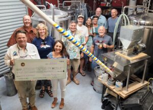 Pareidolia Brewing Co. presents check to Hibiscus 