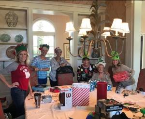 Ladies wrapping gifts